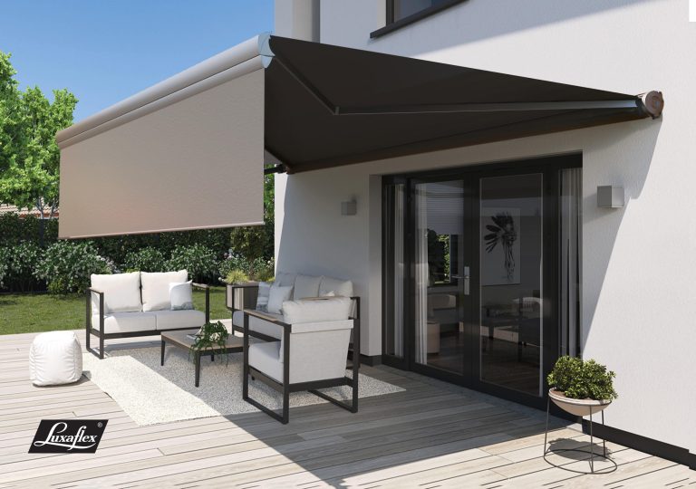 Luxaflex retractable patio awning with valance shading modern outdoor lounge furniture on a deck beside glass doors